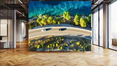 View of the road along the coast from the drone. Travel by car in summer time. The sea coast and the road. The coast of Europe. Wall mural