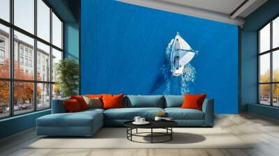 Wave and sail yacht on the sea as a background. .Sea and waves from top view. Blue water background from top view. Top view from drone. Summertime vacation. Travel image Wall mural