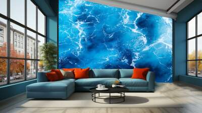 Waves and blue water as a background. View at the ocean surface. Natural summer seascape. Water background. Abstract blue ocean background. Wall mural