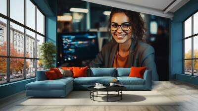 Portrait of smiling female professional Software developer with glasses in office. Wall mural