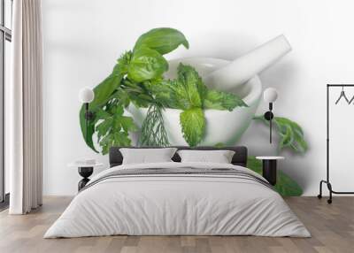 Aromatic green herbs in ceramic mortar on table Wall mural