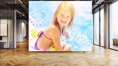 Beautiful little girl sunning at the pool Wall mural