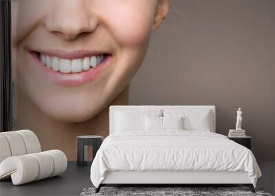 Beautiful smile of young woman with healthy white teeth Wall mural