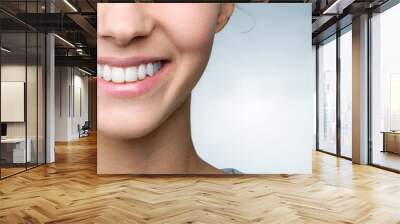 Beautiful smile of young woman with healthy white teeth Wall mural