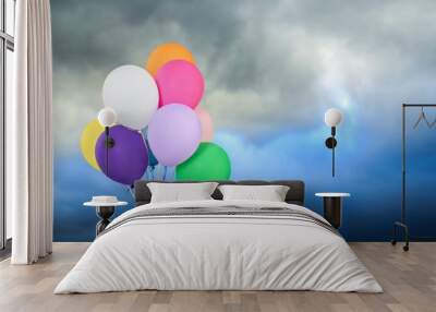 Bunch of colorful balloons on sky background Wall mural