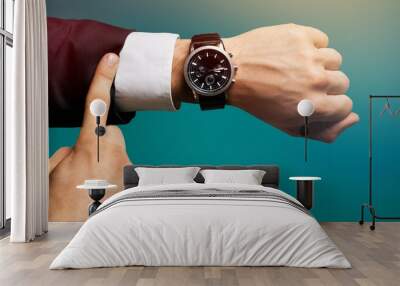 Businessman with hand watch on background, close-up Wall mural