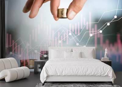 Economic crisis concept. Hand hold money coins Wall mural