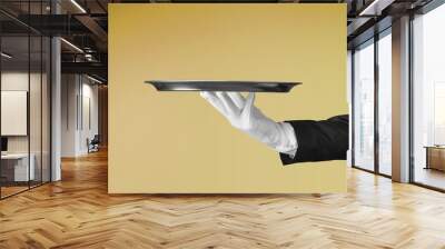 Elegant waiter hand in white glove holding an empty plate Wall mural