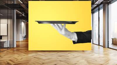 Elegant waiter hand in white glove holding an empty plate Wall mural