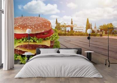 Fresh tasty burger dish on the desk Wall mural