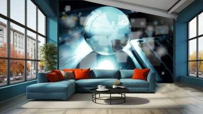 Glass globe on laptop Wall mural