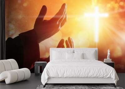 Hands of human praying on blurred background Wall mural