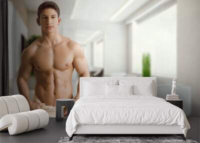 Handsome muscle sporty young man posing Wall mural