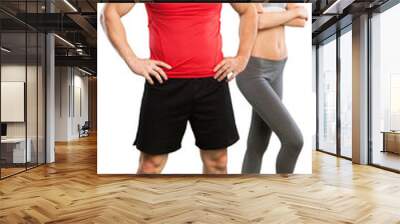 Happy caucasian couple man woman personal trainer exercising Wall mural