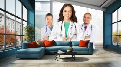 Happy doctor, nurse medical professional in hospital Wall mural