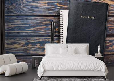 Holy bible with note book and pencil on table for christian devotion Wall mural