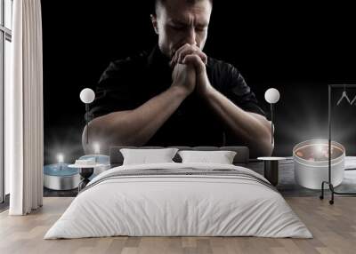 human pray to Jesus Christ with candle light Wall mural