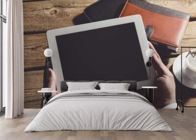 Ipad. Tablet computer with isolated screen in male hands. Wall mural