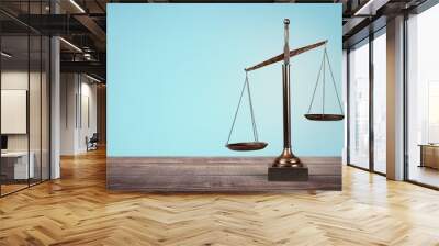 Lawyer. Law scales on table in front black background. Symbol of Wall mural