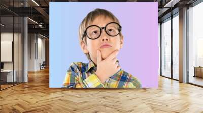 Let me think. Caucasian clever schooler with puzzled serious expression, child thinking Wall mural