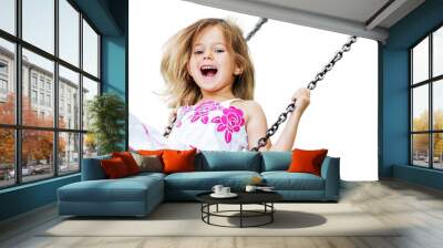 Little child blond girl having fun on a swing Wall mural