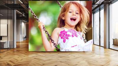 Little child blond girl having fun Wall mural