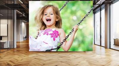 Little child blond girl having fun Wall mural