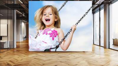 Little child blond girl having fun Wall mural