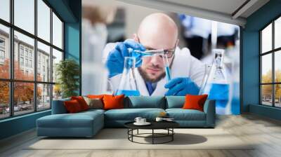 Man researcher carrying out scientific research. Wall mural