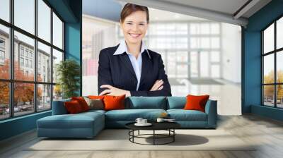 Mature businesswoman wearing formal suit on background Wall mural