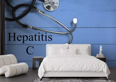 Medical stethoscope with the word hepatitis c and a blue background Wall mural