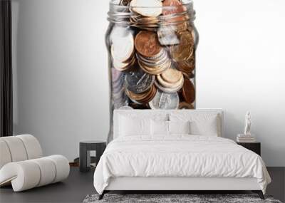 Money Jar with coins on white background Wall mural