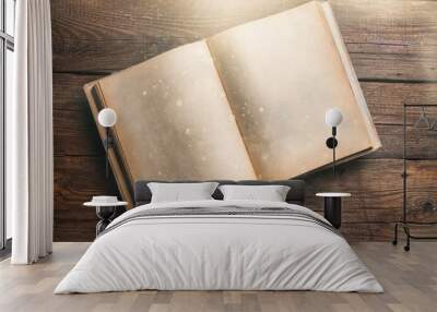 Open book on old wooden table Wall mural