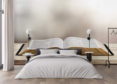 Open vintage christian bible on desk Wall mural