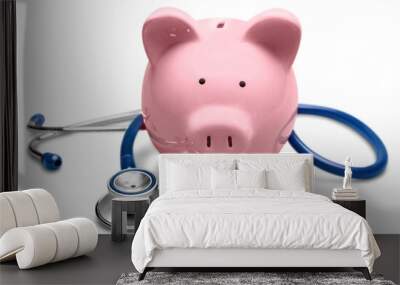 Piggy bank with medical stethoscope isolated on white, health insurance Wall mural