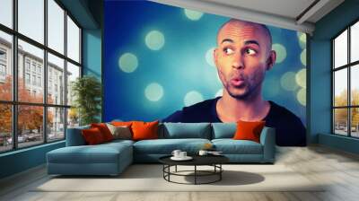 Portrait of handsome young man with facial expression on Wall mural