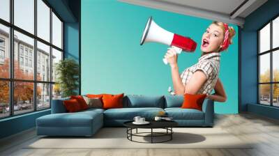 Portrait of woman holding megaphone, dressed in Wall mural