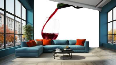 Pouring red wine in a glass isolated on white background Wall mural