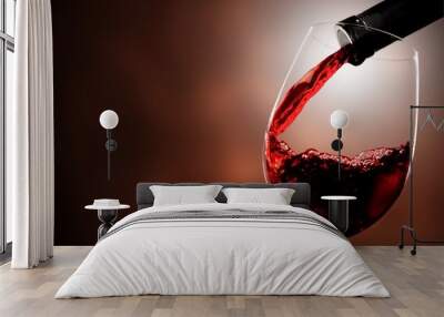 Red wine pouring in glass on  background Wall mural