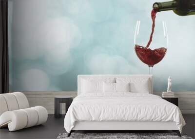 Red wine pouring in glass Wall mural