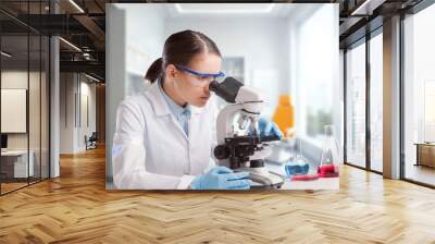 Science, woman in a laboratory do research or experiment. Wall mural