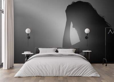 Silhouette of woman. Wall mural