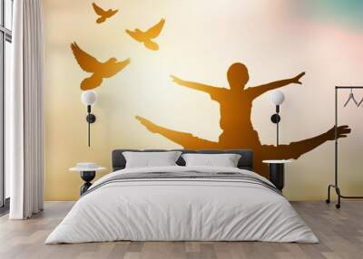 Silhouette of young family and free birds fly Wall mural