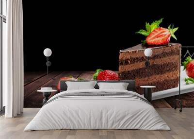 Slice of delicious chocolate cake on desk Wall mural