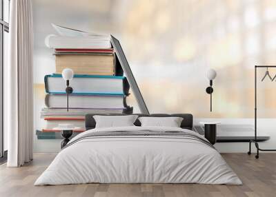 Stack of books with laptop Wall mural