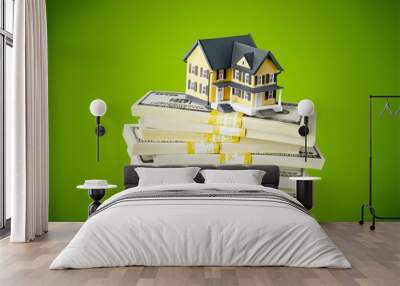 Stack of money with house on background Wall mural