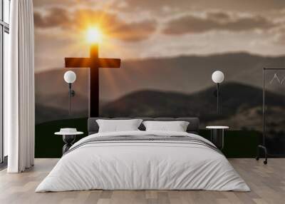 The concept of the Christian faith. Wooden cross, mountain and light Wall mural