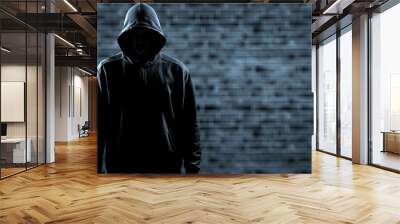 Thief in black clothes on grey background Wall mural