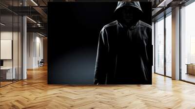 Thief in black clothes on grey background Wall mural