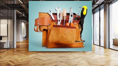 Tool belt with tools on pastel gradient background Wall mural